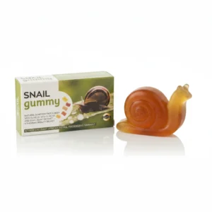 A square-shaped bar of translucent, gummy-like soap with a snail illustration on the label
