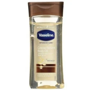 A bottle of Vaseline Cocoa Radiant Body Oil with a white label and cocoa-colored liquid inside