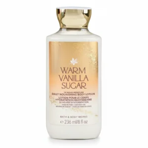 A white bottle with a pink label featuring the Bath & Body Works logo and the words 'Warm Vanilla Sugar Body Lotion'. The bottle has a pump dispenser on top.