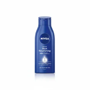 A white bottle of Nivea Nourishing Body Lotion with the Nivea logo and product name clearly visible on the label.