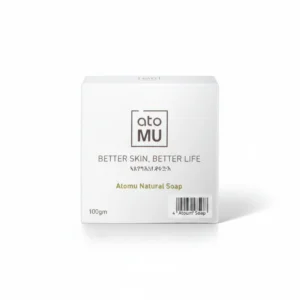 A rectangular bar of ATOMU Gentle Cleansing Soap in a light green color, with the ATOMU logo and product name printed on the label.