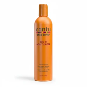A bottle of Cantu Shea Butter Daily Oil Moisturizer with a white and green label. The bottle contains 384ml of product.